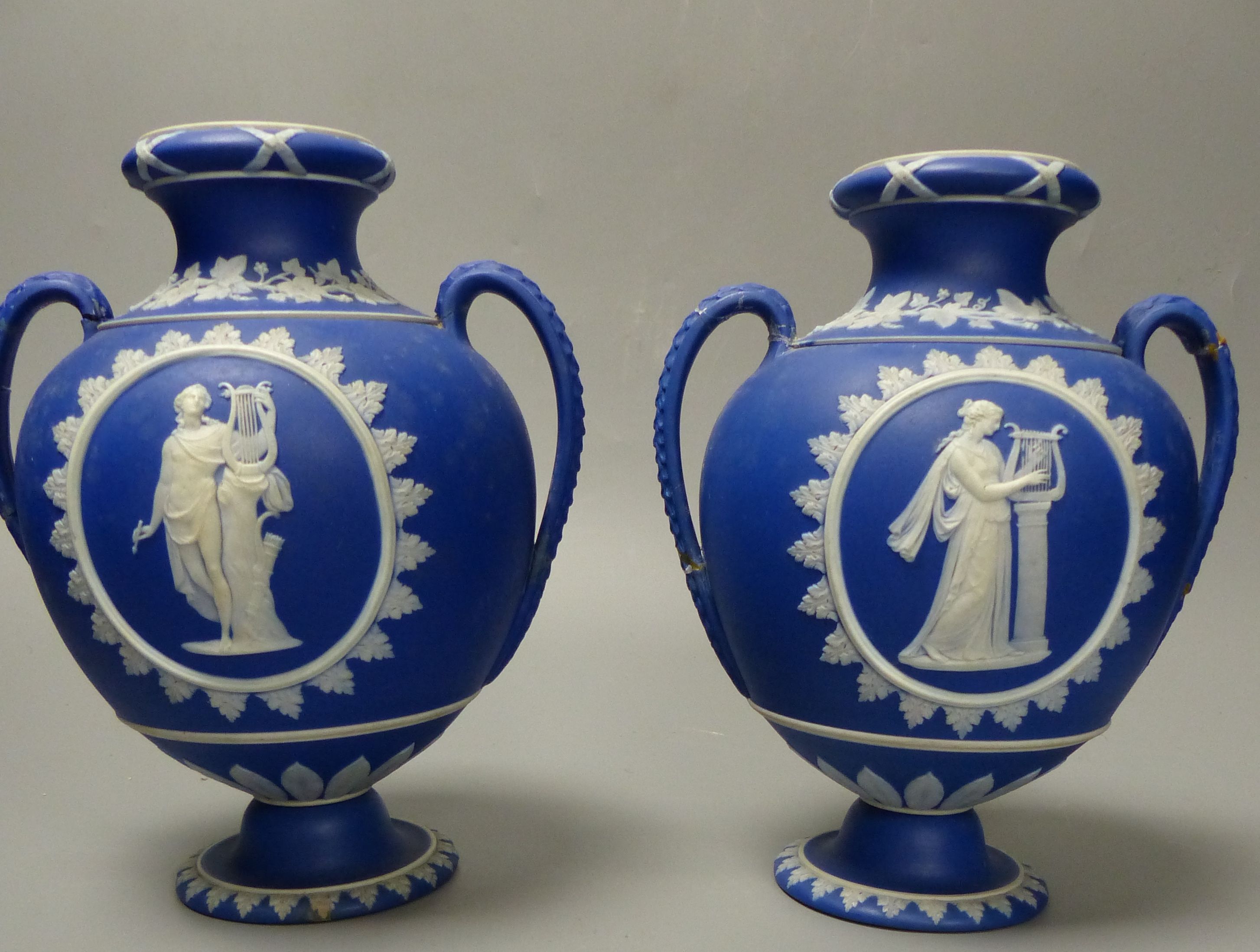 Four pieces of Wedgwood jasper wares including a pair of Victorian blue jasper vases, height 18.5cm, and later dish and pin dish